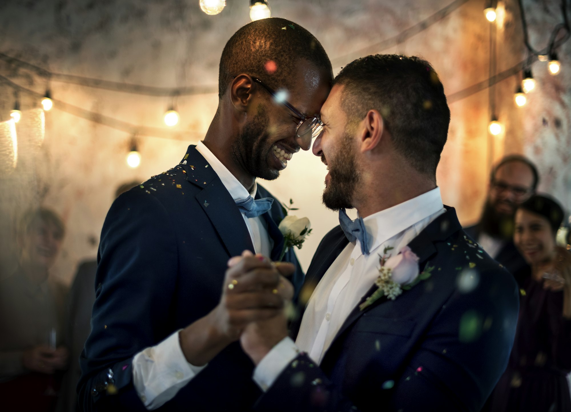 Gay couple dancing on wedding day